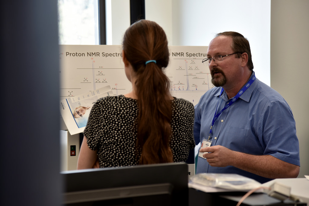 Lloyd Sumner, director of the MU Metabolomics Center, and Assistant Professor Ruthie Angelovici discuss the use of NMR for metabolite identification during the University of Missouri Metabolomics Center open house on Aug. 12. | photo by Zivile Raskauskaite, Bond LSC