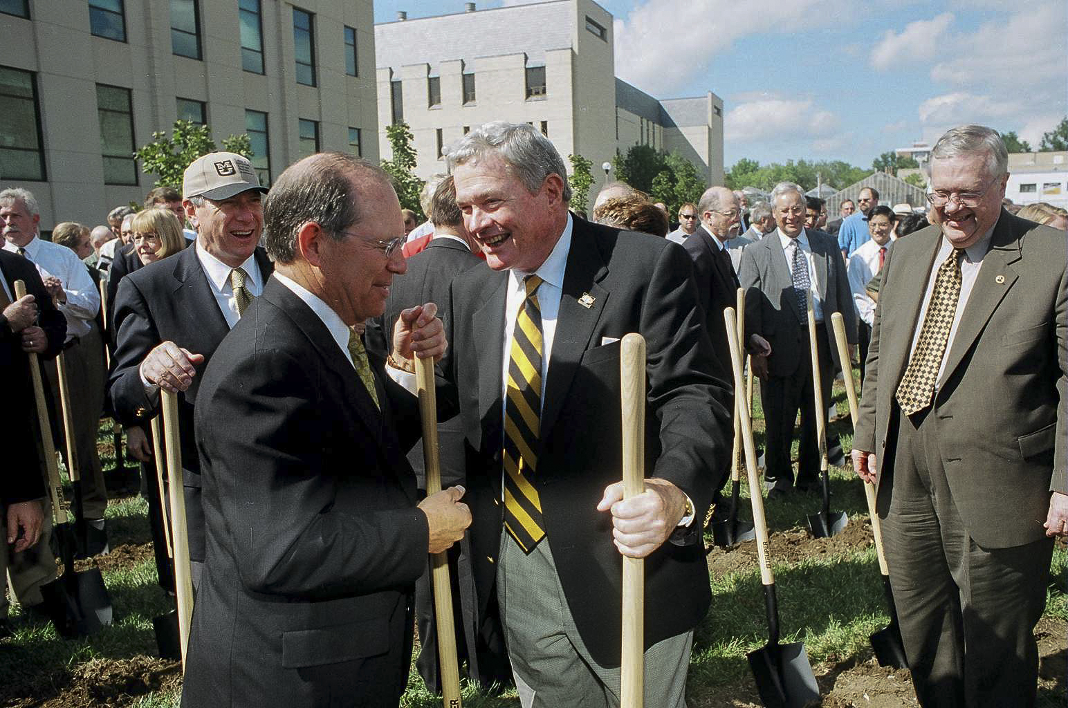 Kit Bond speaks to Thom Payne, vice chancellor for agriculture and dean of the College of Agriculture, Food and Natural Resources, at the groundbreaking for the Christopher S. Bond Life Sciences Center on September 8, 2001.